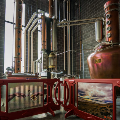 Dented Brick Distillery - 500 Gallon Copper Batch Still System, 12" Stainless Steel Stripping Still, and Vodka Column (photo by Barry Martak) - Salt Lake City, UT