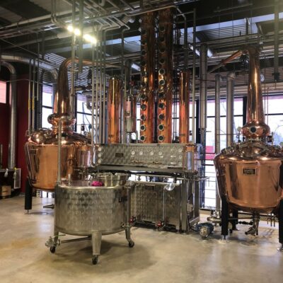 McAuslan Brewing Co. - 2000 Litre(left) and 1000 Litre(right) Copper Batch Still with Dual Rectifying Columns and Gin Basket - Montréal, Québec, CA