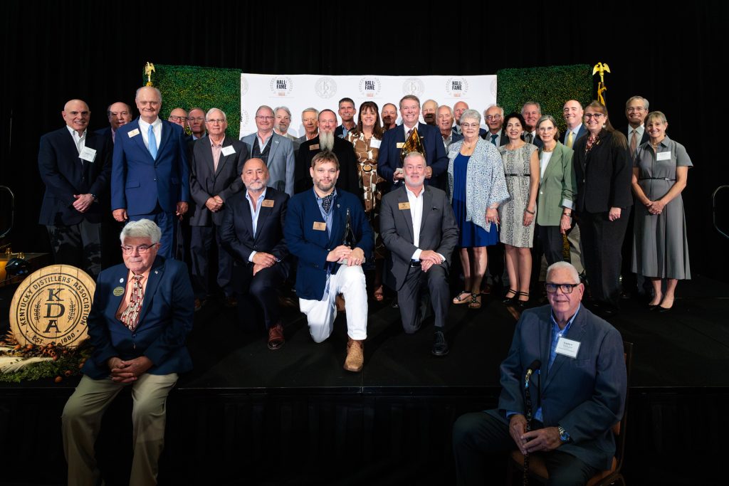Kentucky Bourbon Hall of Fame members past and present gathered on stage after the 2026 induction ceremony