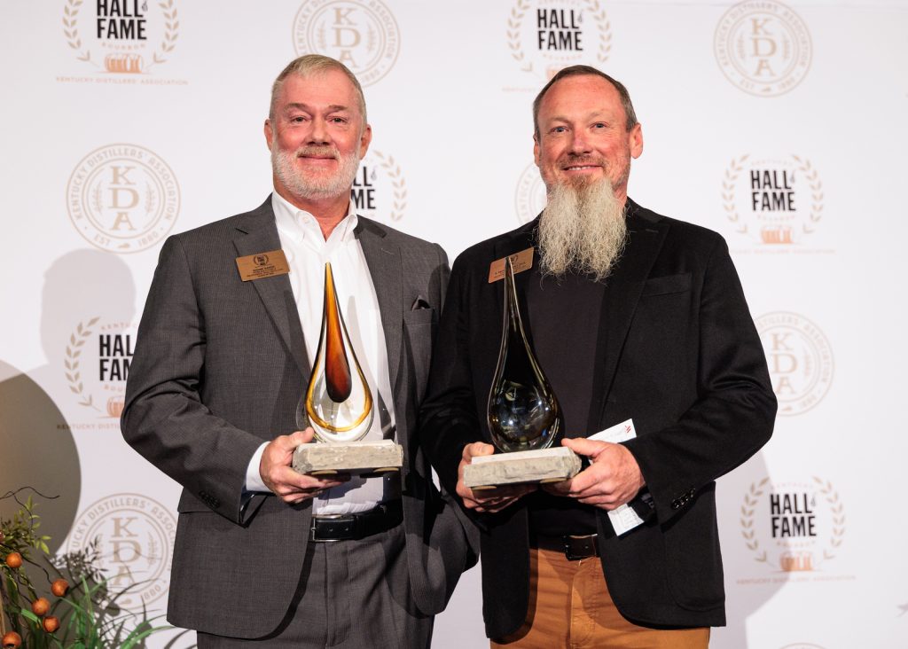 Shane Baker and Pat Heist of Wilderness Trail Distillery holding their 2026 Kentucky Bourbon Hall of Fame awards